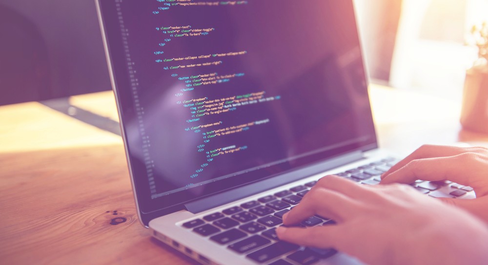 Woman hands coding html and programming on screen laptop.